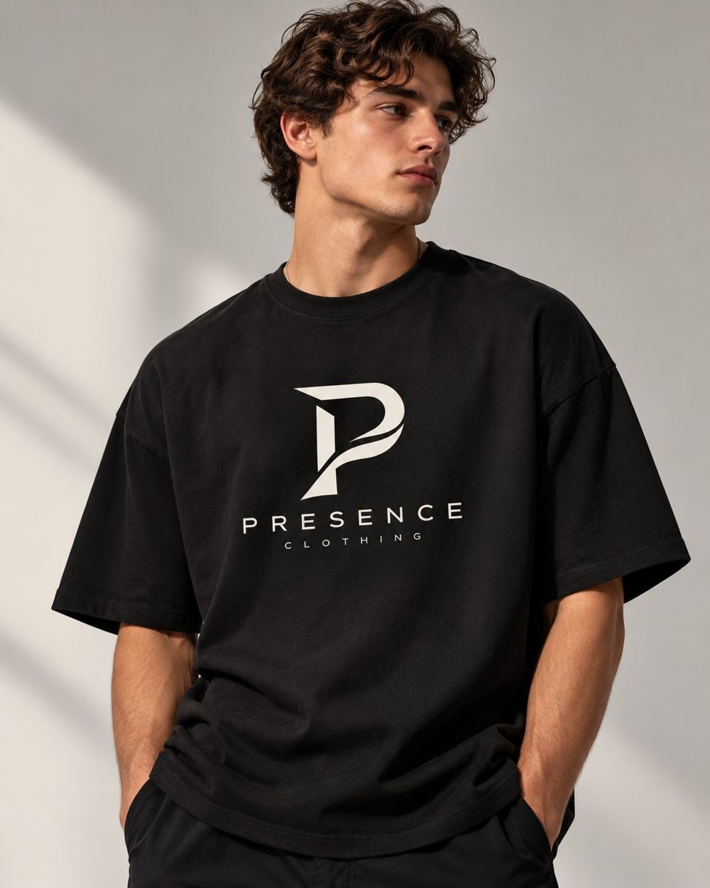 Man wearing the black Presence Tee